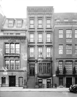 Brownstone surrounded by two other buildings at 14 East 81 Street.