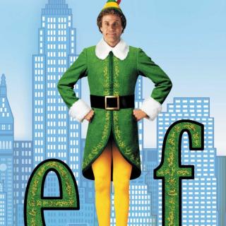 威尔·法瑞尔身着绿色和黄色“精灵”服装，身着蓝色背景的城市景观，站在字母“e”和“f”之间。