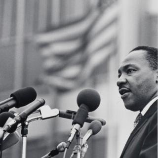 A museum photo by Benedict J. Fernandez of [Dr. Martin Luther King, Jr.] during April 15, 1967.