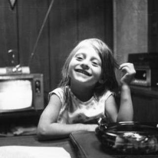 a black and white childhood photograph of Maria Bartiromo