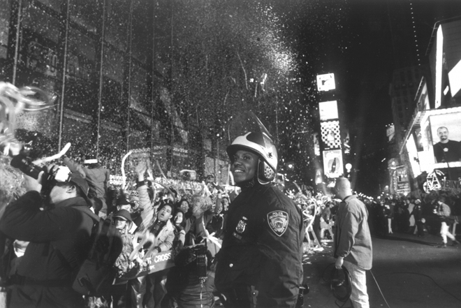 Steffen A. Kaplan (no dates). Police officer and crowd at (11:59) – 12am – N. Year’s Eve “1997”, 1996-1997. Museum of the City of New York. 2001.3.5