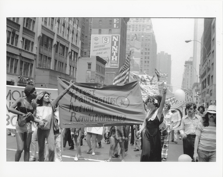 Members of the Street Transvestites Action Revolutionaries hold the group’s banner aloft as they join in the 1973 Christopher Street Liberation Day March.