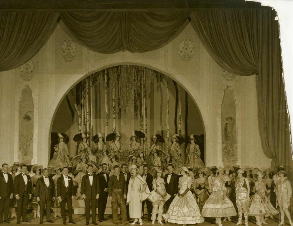 Stage ensemble from the Midnight Frolic with Will Rogers (center), 1917. From the Theater Collection. Museum of the City of New York, 74.92.51