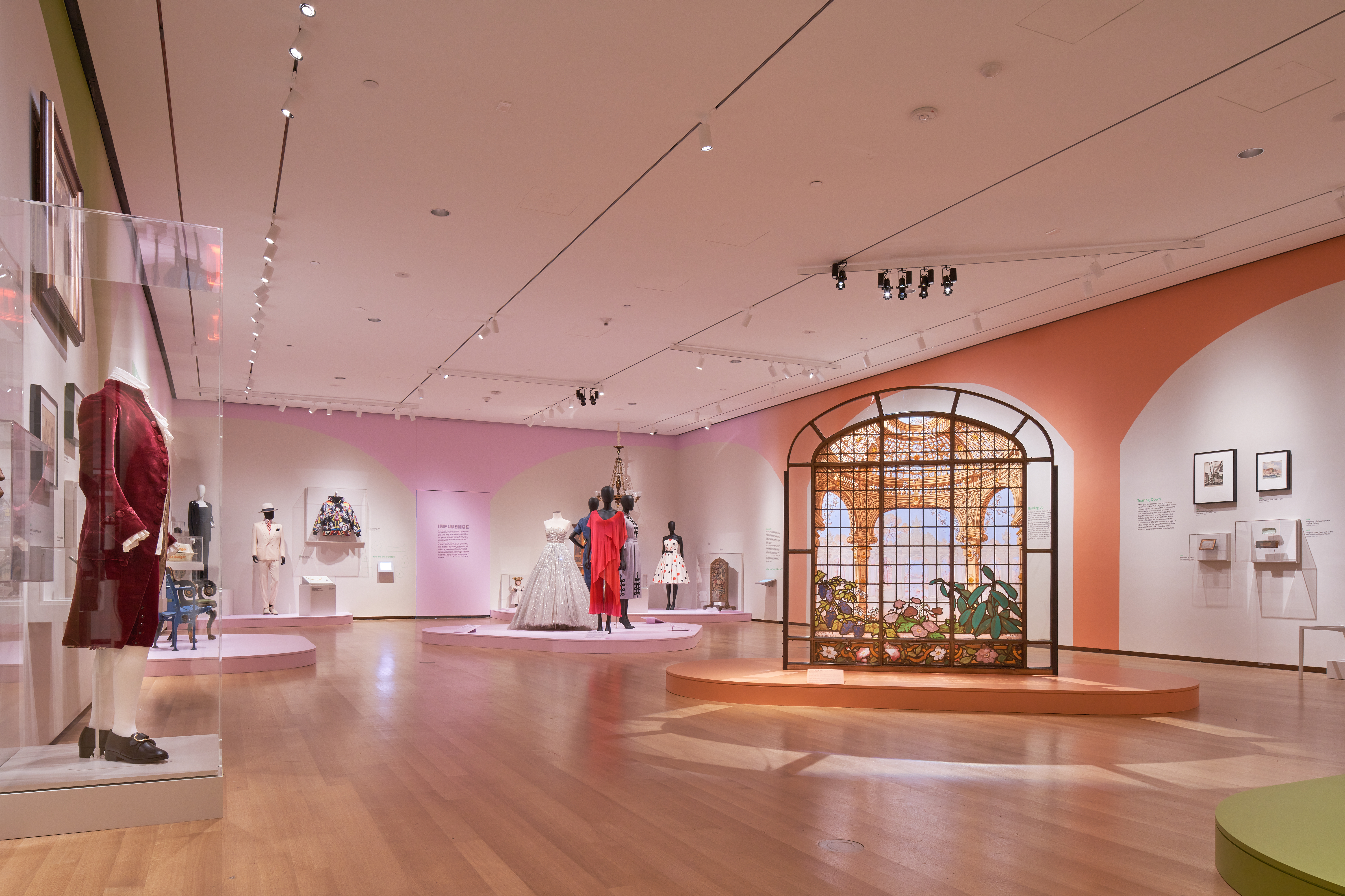 A stained glass panels displayed in a gallery. 