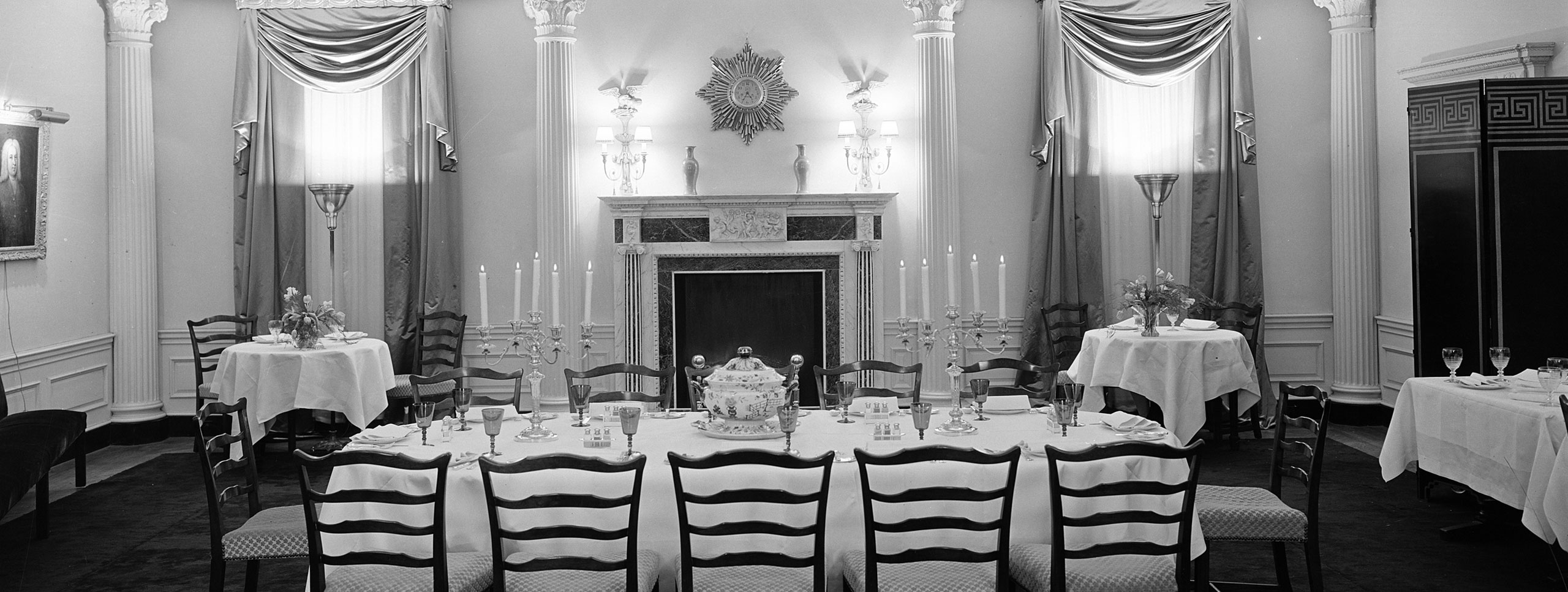 Extravagantly furnished dining room at 960 Fifth Avenue. The setting includes a central table with elaborate place settings.