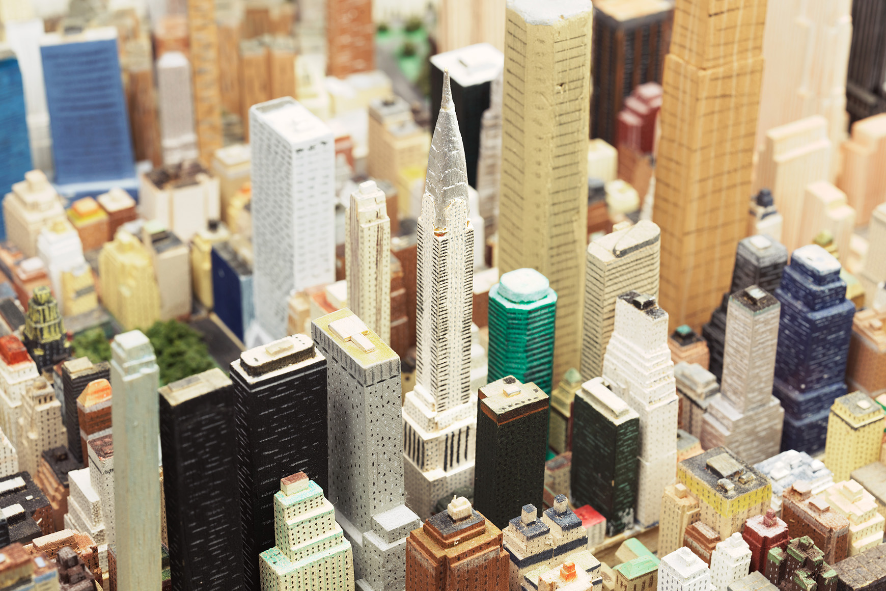 Handmade wooden buildings on scale model of New York City