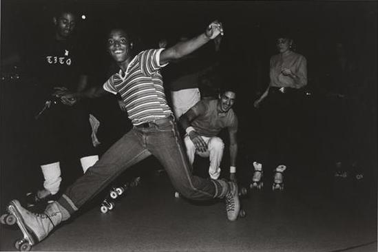 Photograph of a boy in roller skates.