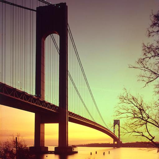 Color photograph of the Verrazano Narrows Bridge at sunset