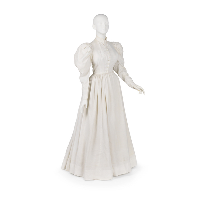 Dress of white linen with leg-of-mutton sleeves. Worn as uniform by Lillian D. Wald, founder of the Visiting Nurse Service of N.Y., 1893