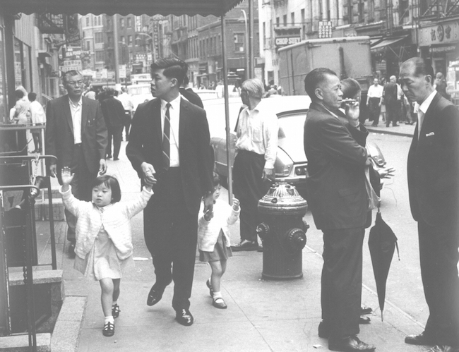 Black and white photo of people on Mott Street