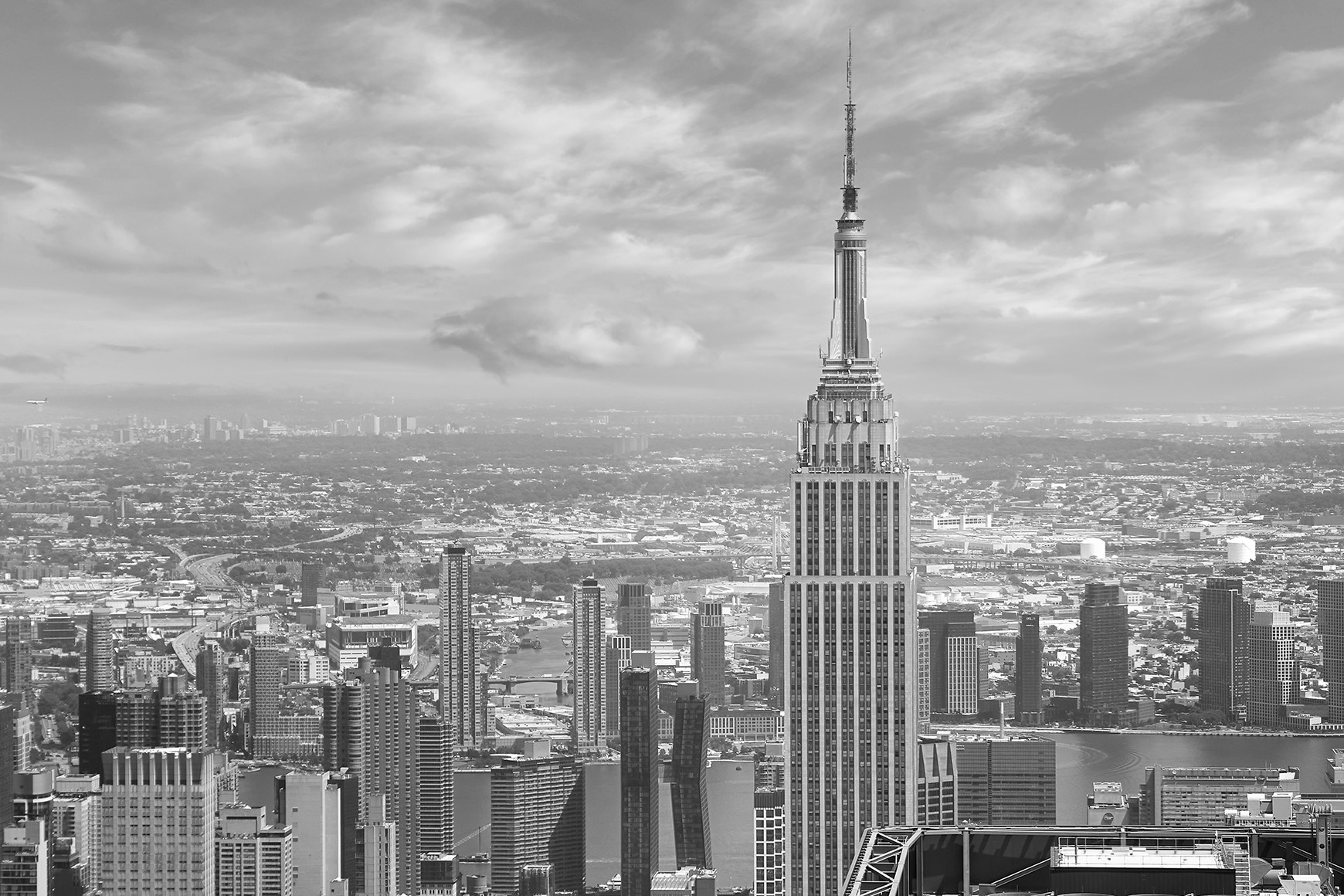 A black and white photograph of buildings in New York City