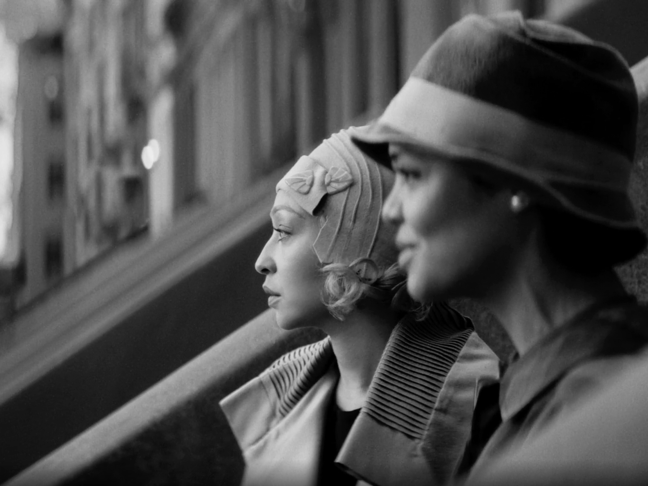 Still image from movie Passing of two women on a city porch