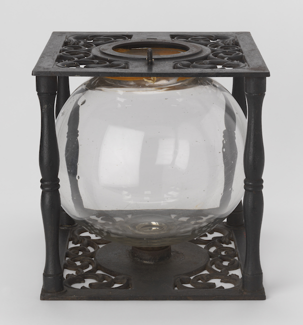 Ballot box with glass globe in cast iron frame.