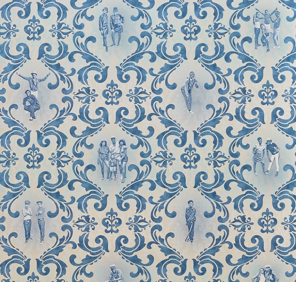 Detail of wallpaper created by Anders Jones and Jamel Shabazz. In blue on a white background, an ornate, repeating scroll pattern features across the wallpaper. Silhouettes of mages taken by Shabazz appear in the centerpieces, also in blue