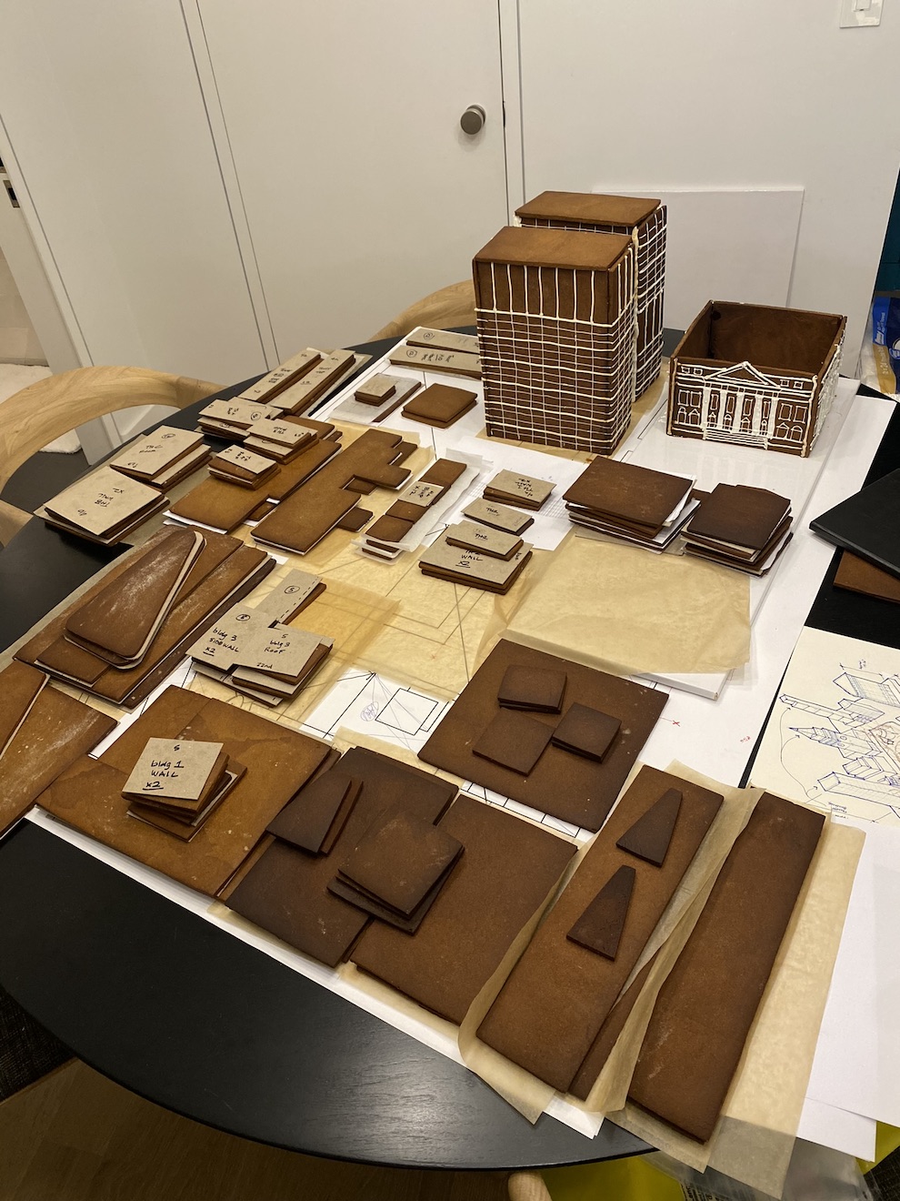 Disassembled, individual pieces of a gingerbread display depicting Madison Square Park.