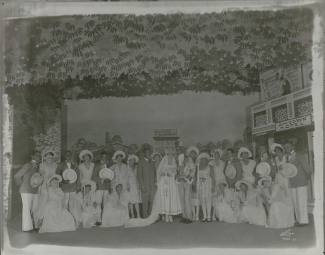 A production still from "Shuffle Along." The cast stands in costume on stage.