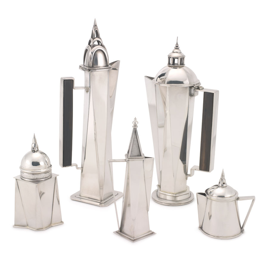 Five-piece angular tea or coffee service set made of silver. Includes four pitchers of varying sizes, and additional piece.