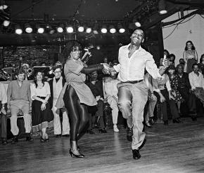 Franking Manning and Norma Miller dancing in front of a crowd.