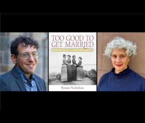 A man and woman smiling next to a book