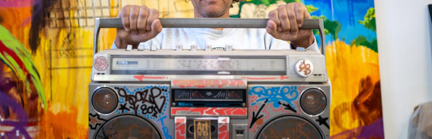 Chris DAZE Ellis holding a boombox