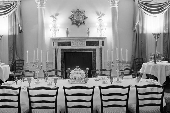 Extravagantly furnished dining room at 960 Fifth Avenue. The setting includes a central table with elaborate place settings.