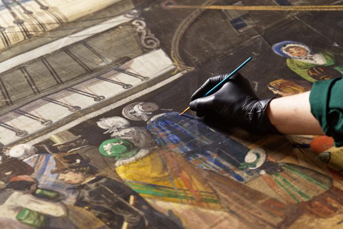 A gloved hand brushes over an old painting of people standing by a ship. 