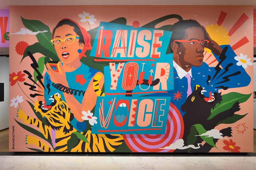 Photograph of the immersive installation "Raise Your Voice," original artwork of activists and allies Yuri Kochiyama and Malcolm X by artist Amanda Phingbodhipakkiya.