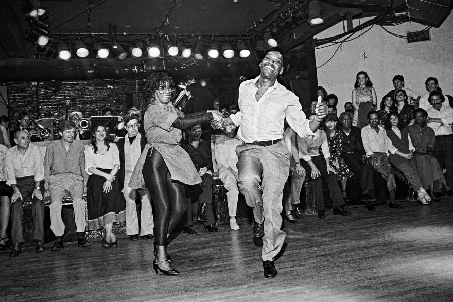 Franking Manning and Norma Miller dancing in front of a crowd.