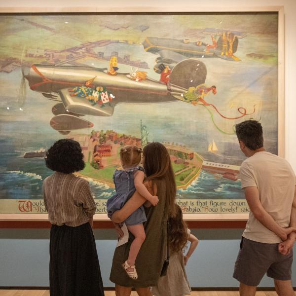 Group of 5 gathers to view Wonderland Mural Pannel; 3 adults 2 children