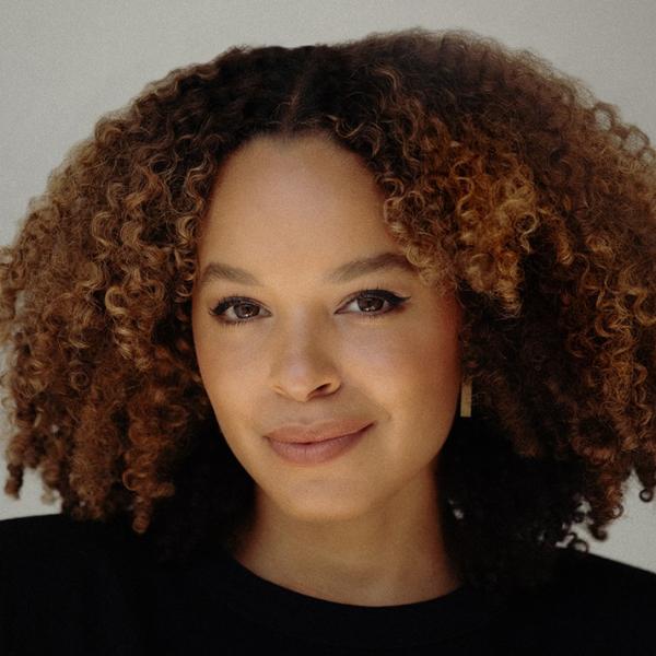 Headshot of a woman wearing a black shirt smiling