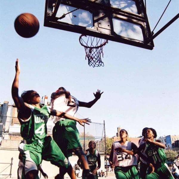 This photograph by Bobbito Garcia shows Bianca Brown #4 and Monique Coker #34 playing a tournament at West 4th Street circa 2003. 