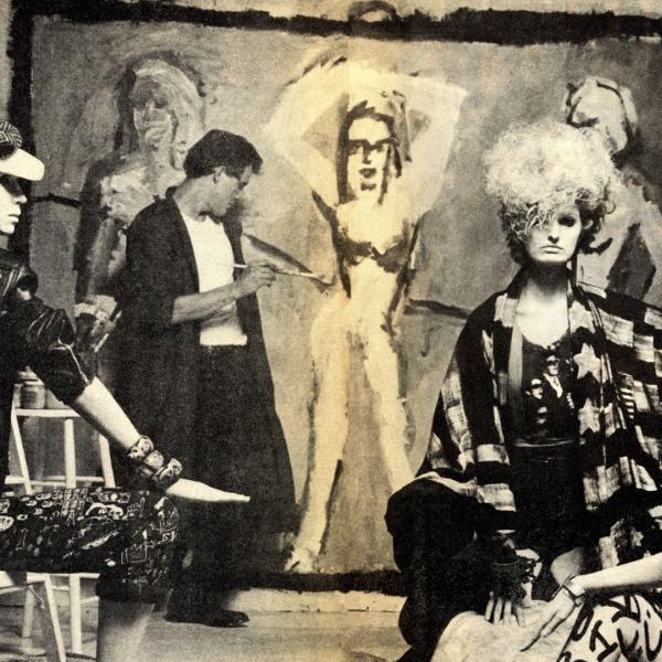 Black and white image of Edward Brezinski painting two sitting models in