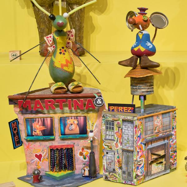 Installation shot of "Puppets of New York," showing Cucarachita Martina and Ratoncito Pérez, two playful puppets conceived by Pura Belpré and made out of recycled materials.