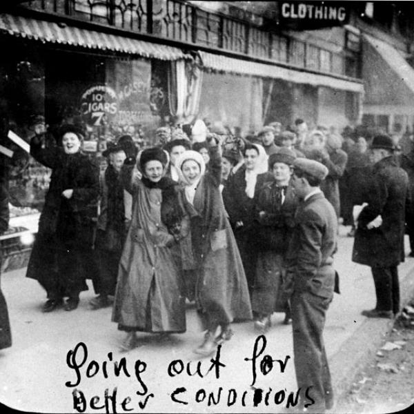 Women garment workers smile for the camera as they go on strike in 1909.