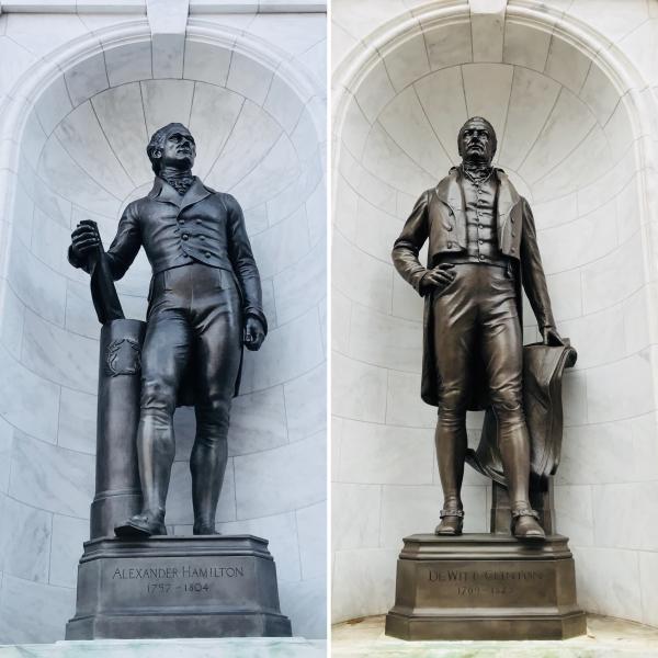 A photo of MCNY statues of Alexander Hamilton and DeWitt Clinton since 1941.