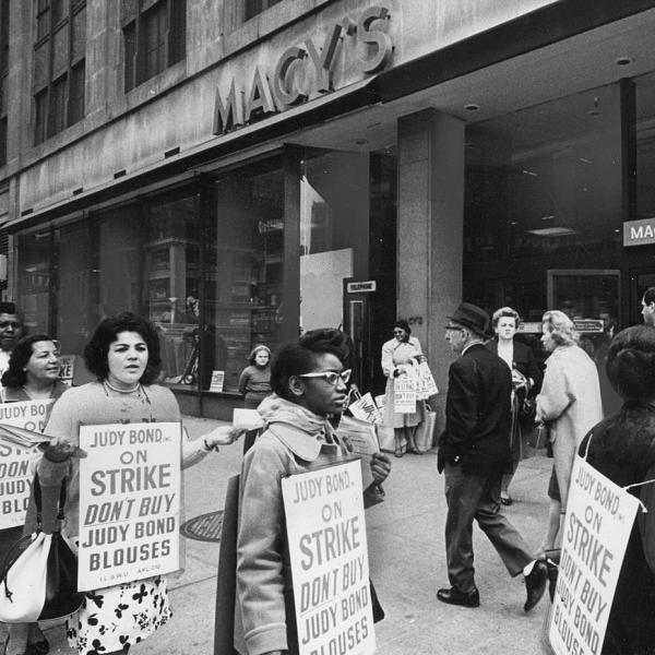 Picketing ILGWU members outside Macy's department store urge shoppers not to buy Judy Bond blouses