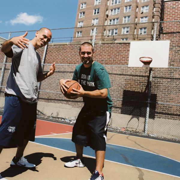 Filmmakers Bobbito Garcia & Kevin Couliau on a basketball court