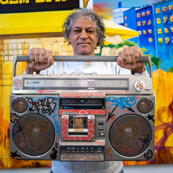 Chris DAZE Ellis holding a boombox