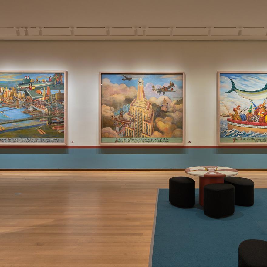 Large mural panels showing Alice and other characters exploring New York City, with red and white tables in the middle of the gallery.