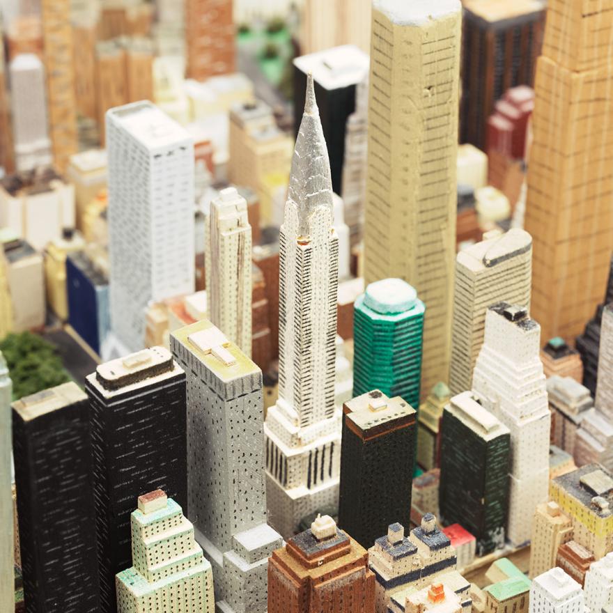 Handmade wooden buildings on scale model of New York City