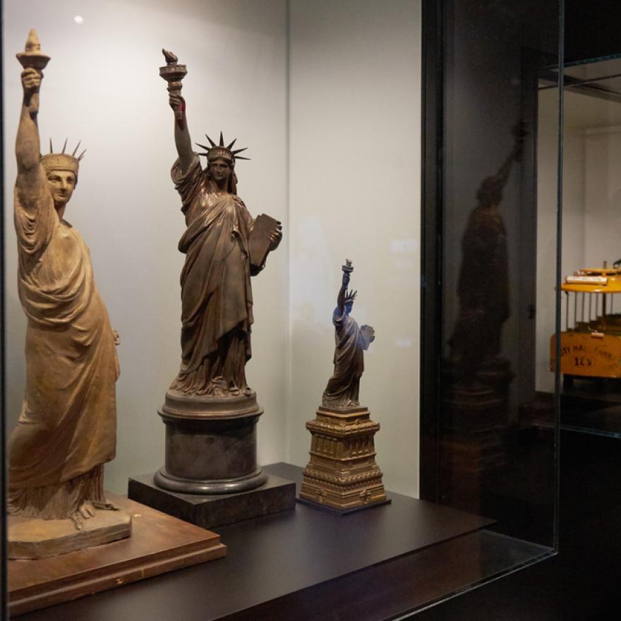 Mock-ups and models of the Statue of Liberty on display in an exhibition