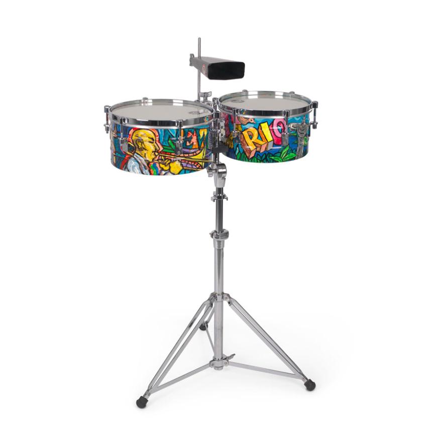 Timbales, high tuned drums with metal casing, and a cowbell. The sides of the timbales are painted in a graffiti-like style
