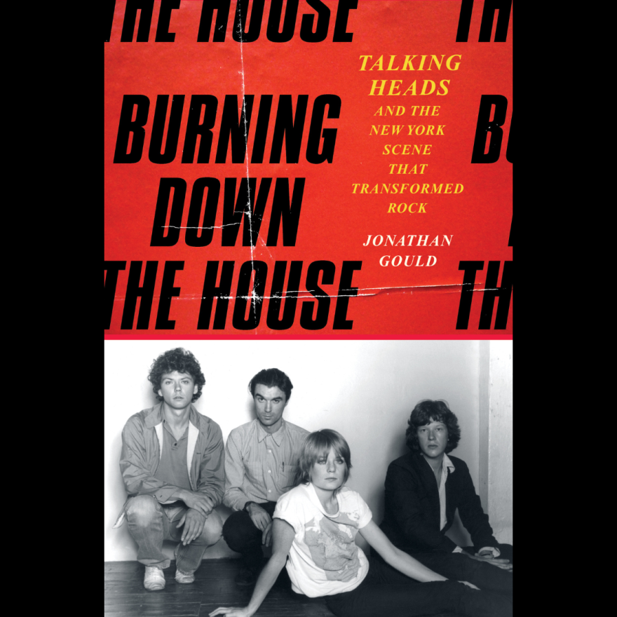 cover of book with four people sitting on the floor and black lettering on a red background above them