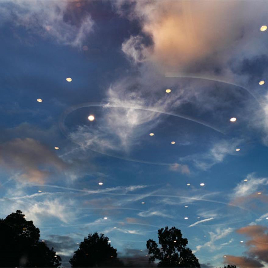 The night sky in Prospect Park with reflections of the lights from below.