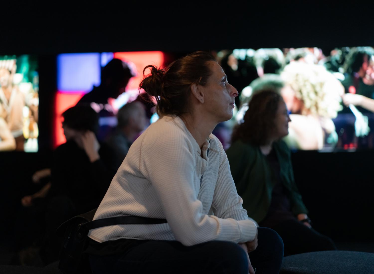 Two women watching films