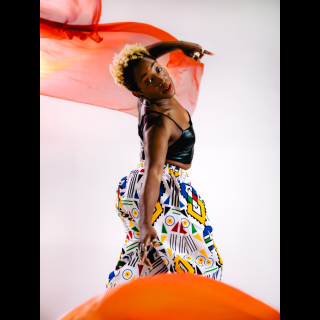 Image of dancer LaTasha Barnes posing in a dance position