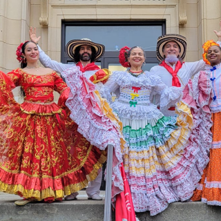 Traditional cumbia dancers posing 
