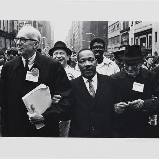 Photograph of Dr. Martin Luther King, Jr., Dr. Benjamin Spock and Monsignor Rice of Pittsburgh at the Solidarity Day Parade in New York City on April 15, 1967. 