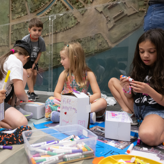 A group of students participating in an art activity. 