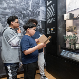 Three students looking at a case in NY at its Core